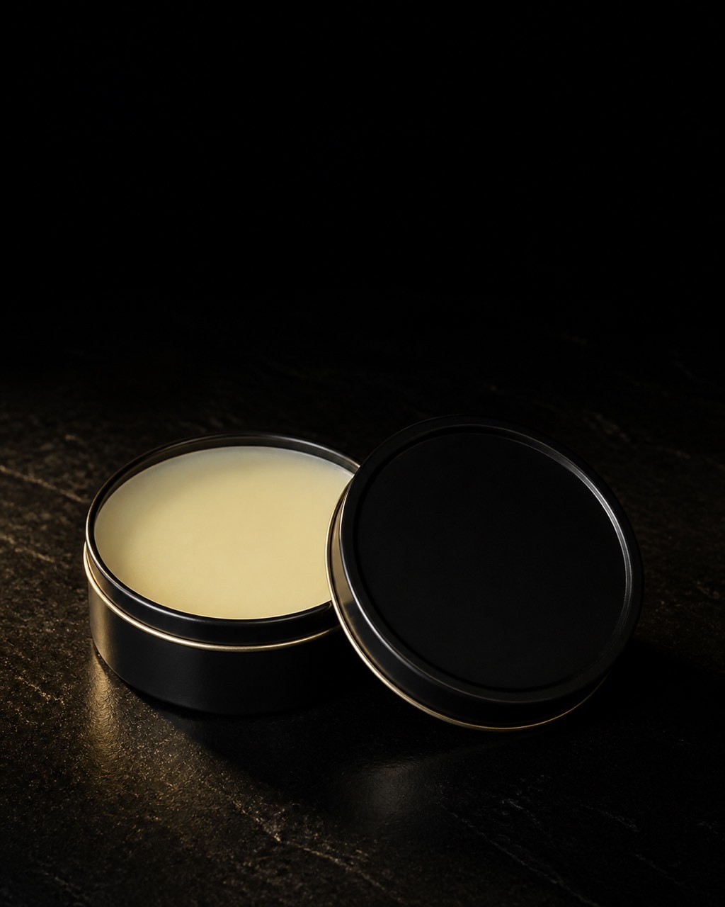 Beard Butter — facial-hair balm — standing alone against near-black under a single warm gold light.
