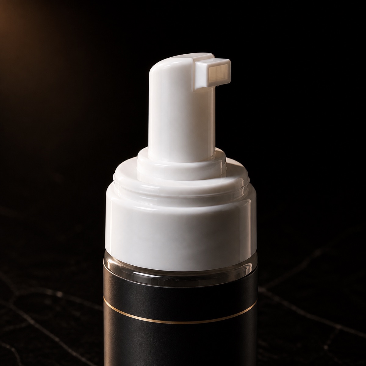 Bounce Boost Mousse — the working end at magnification — under a single warm gold light on black.