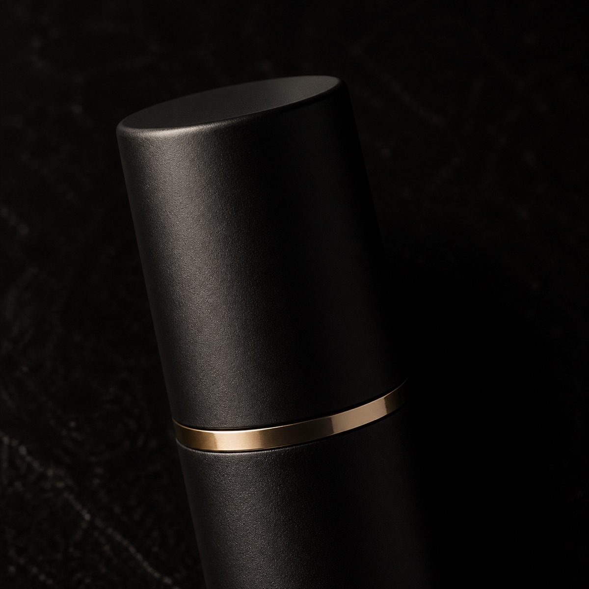 Oil-Free Daily Moisturizer — the working end at magnification — under a single warm gold light on black.
