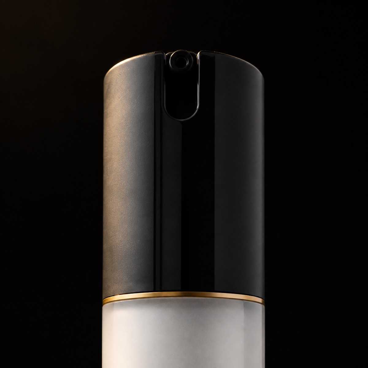 Soothing Moisturizer — the working end at magnification — under a single warm gold light on black.