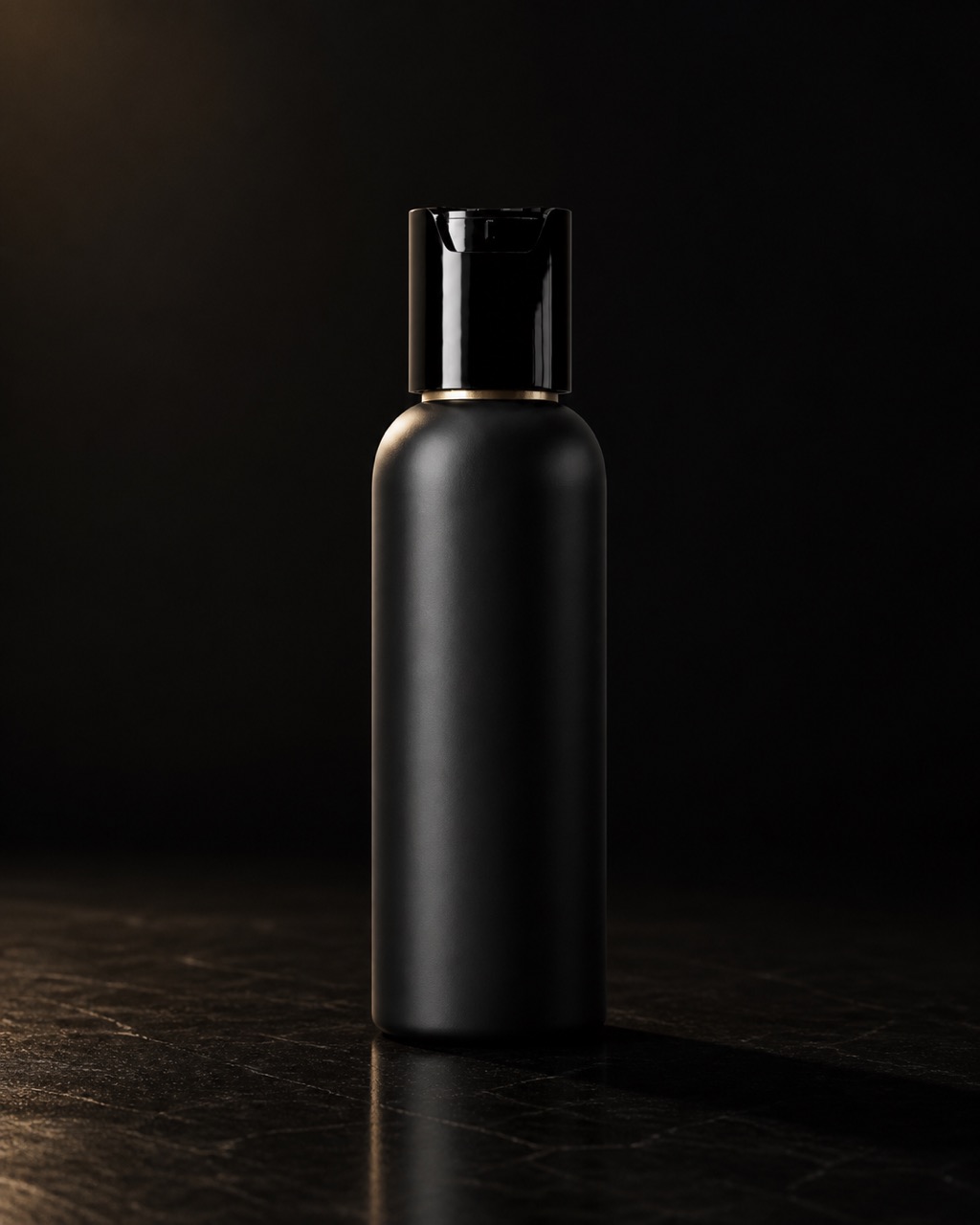 Charcoal Facial Cleanser — charcoal cleanser — standing alone against near-black under a single warm gold light.