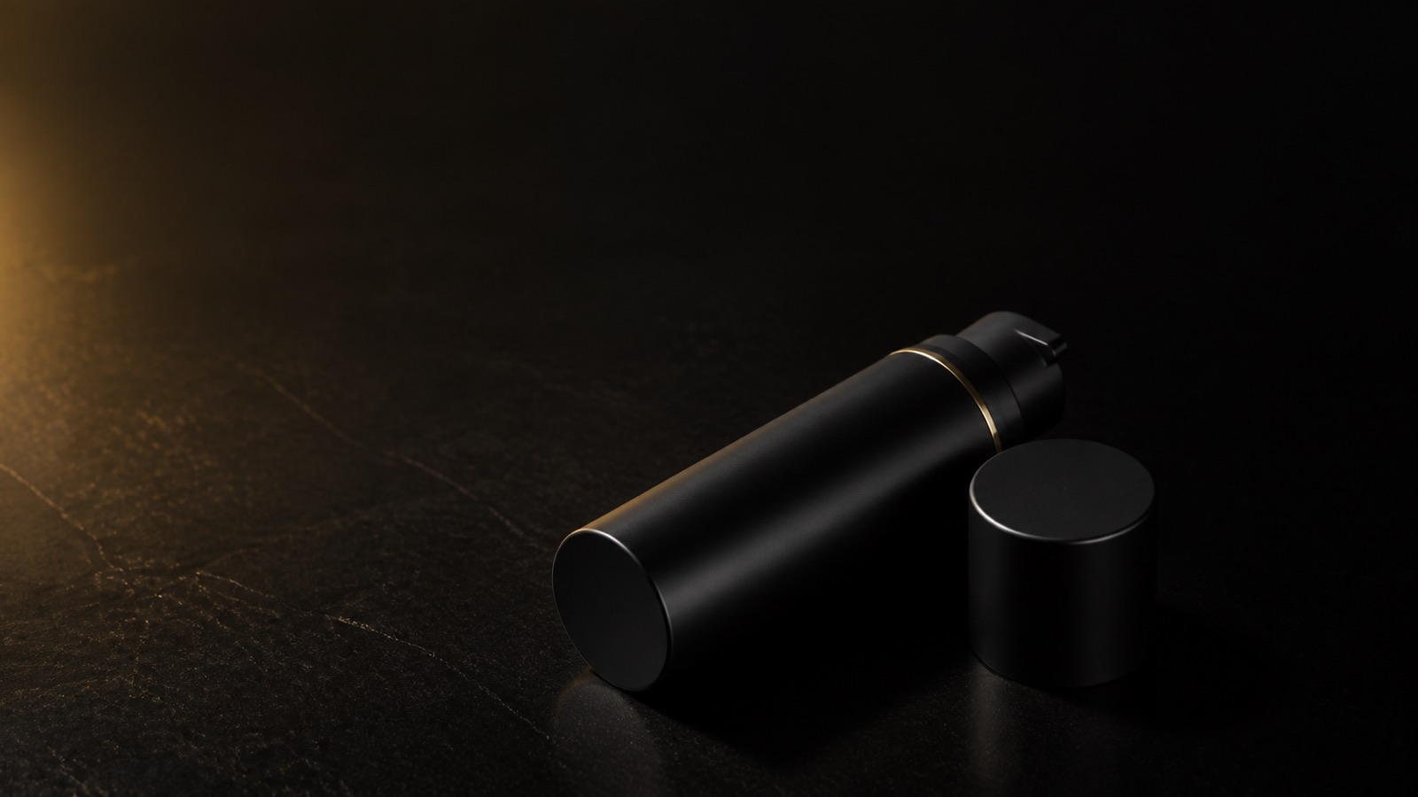 Peptide Eye Gel-Cream — seen in three-quarter view, low in a wide frame — under a single warm gold light on black.