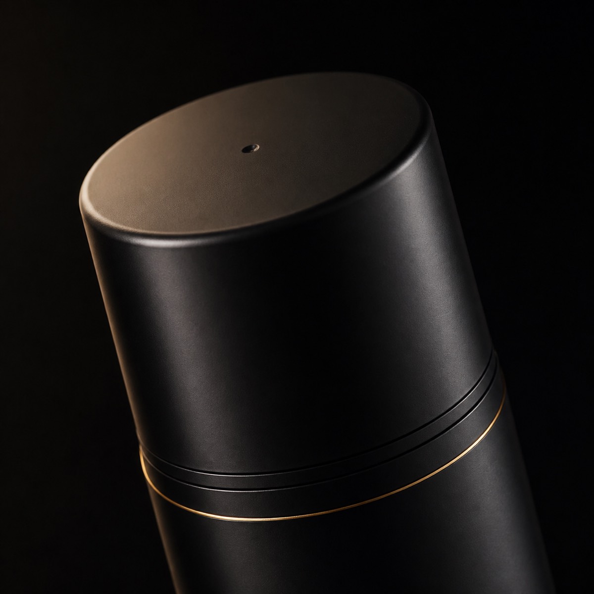 Peptide Eye Gel-Cream — the working end at magnification — under a single warm gold light on black.