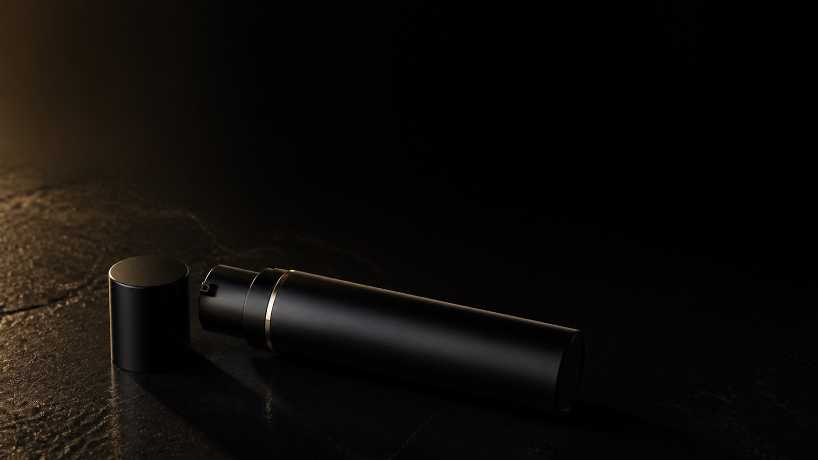 Hydro Balancing Gel-Cream — seen in three-quarter view, low in a wide frame — under a single warm gold light on black.