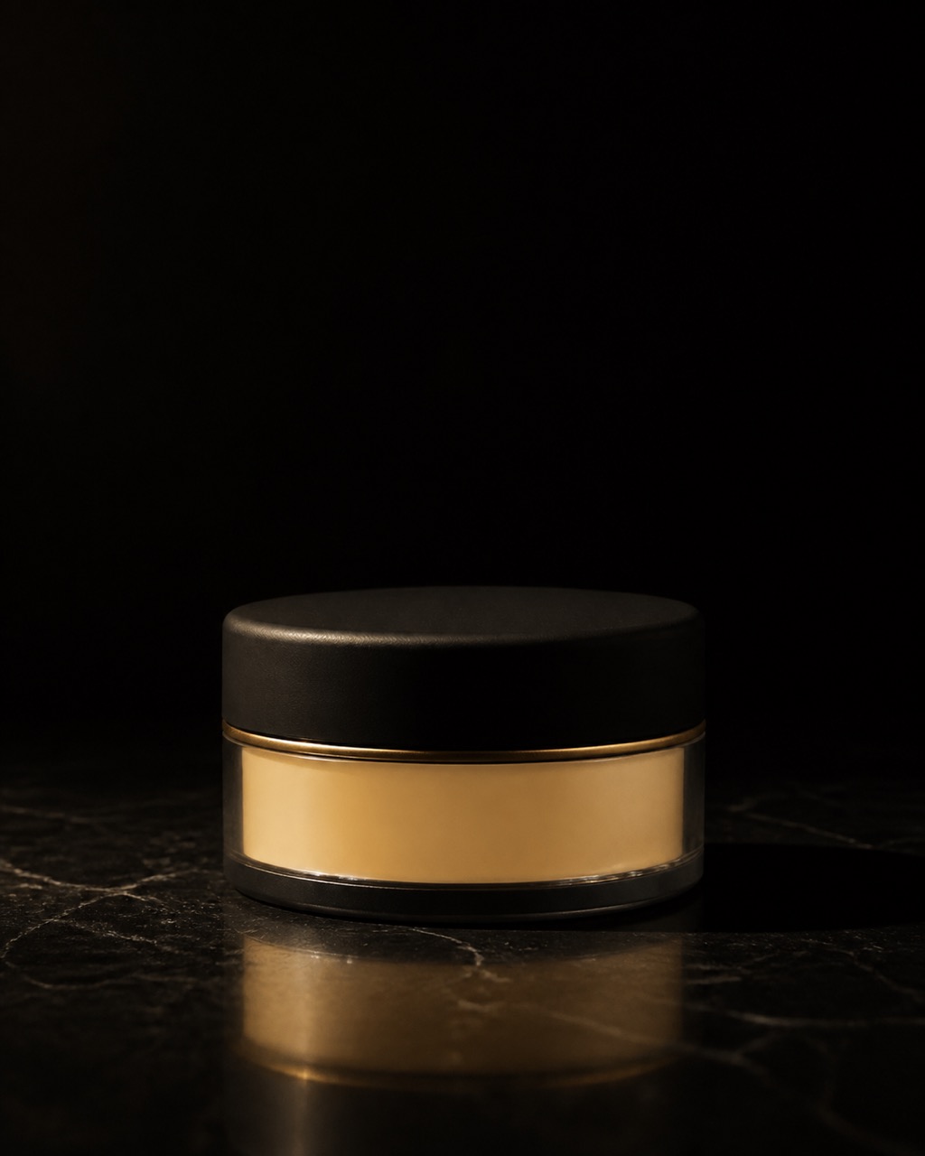 Loose Powder — Banana — tone-aware loose powder — standing alone against near-black under a single warm gold light.