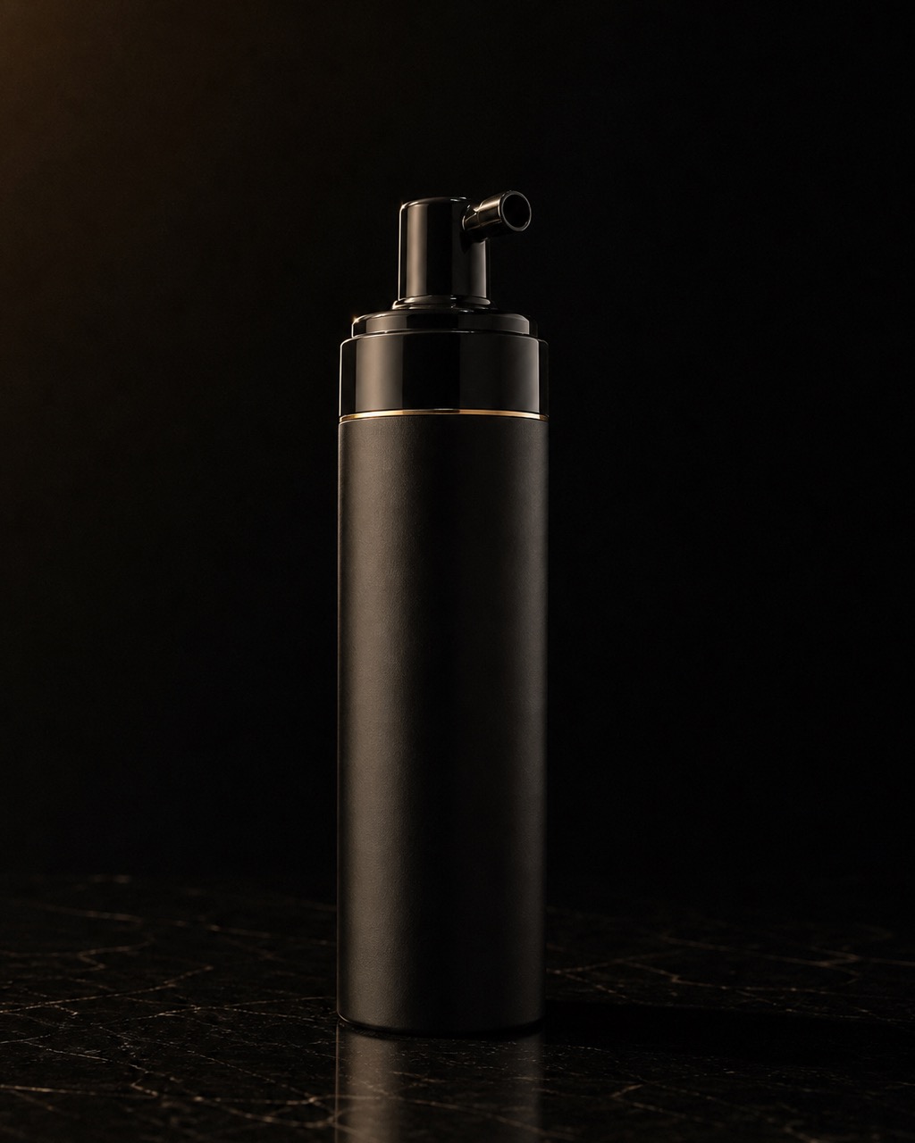 Foaming Cleanser — full-size cleanser — standing alone against near-black under a single warm gold light.