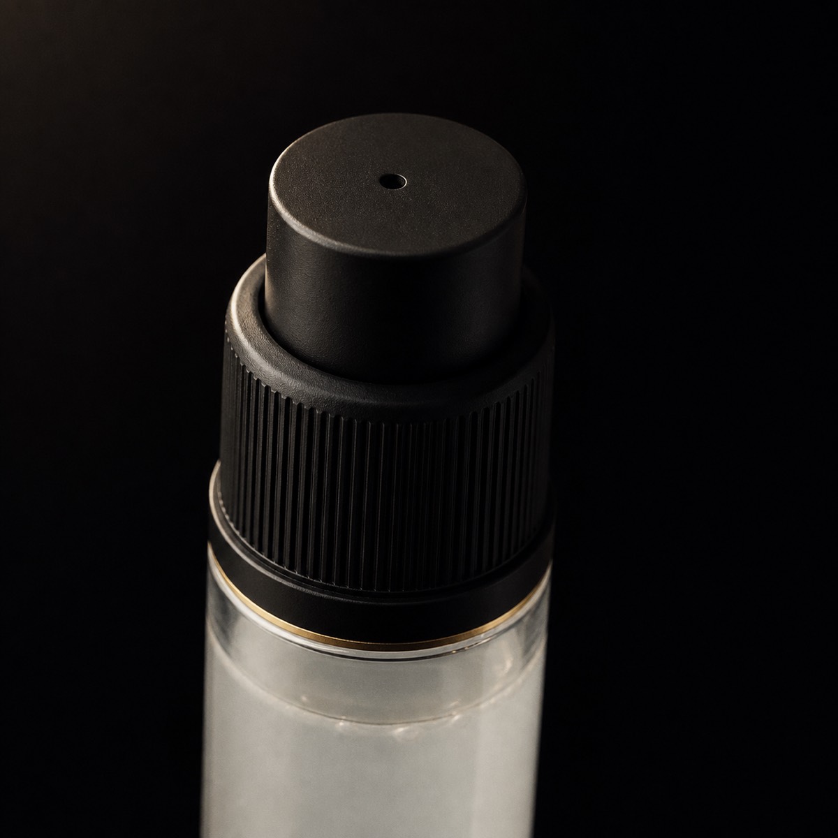 Perfect Canvas Primer — the working end at magnification — under a single warm gold light on black.