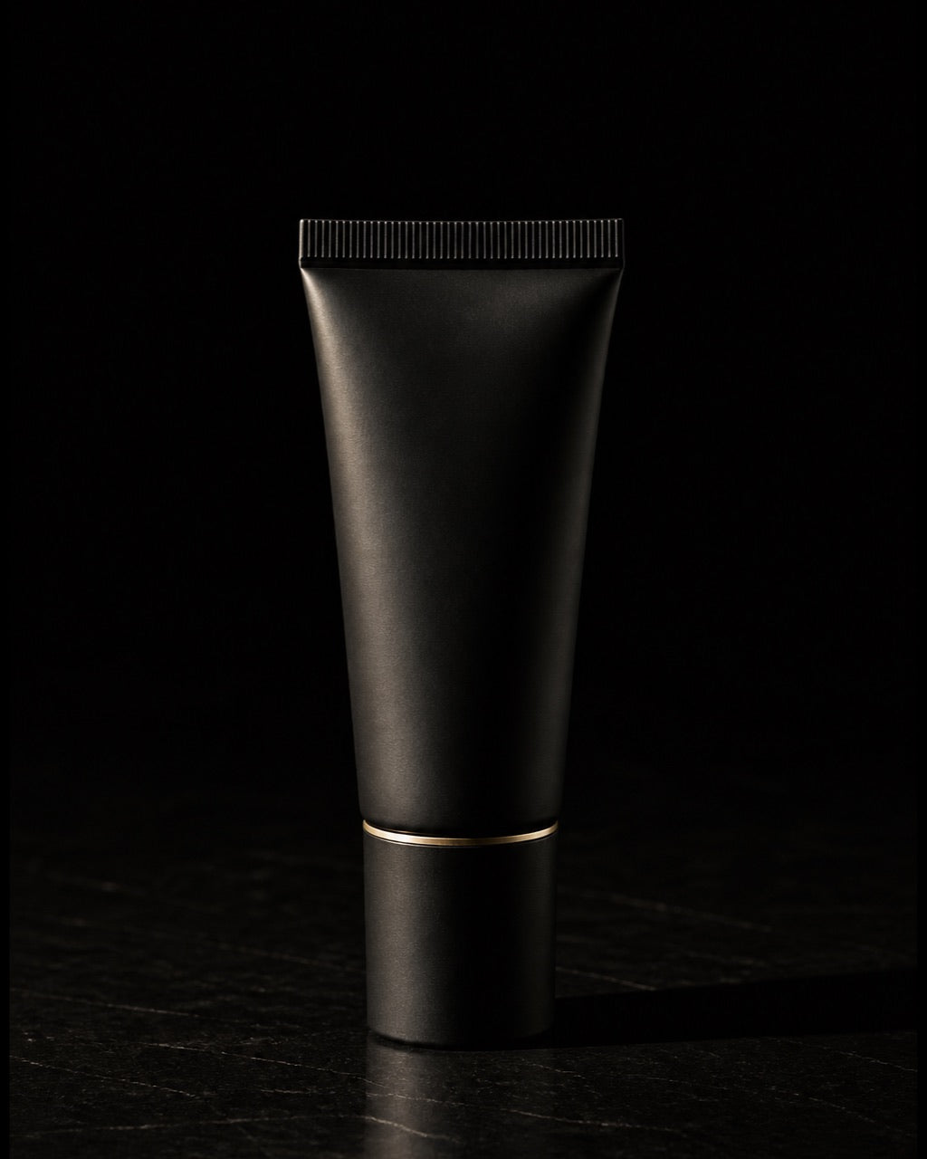 Bronzing Moisturizer — standing alone, complete — under a single warm gold light on black.