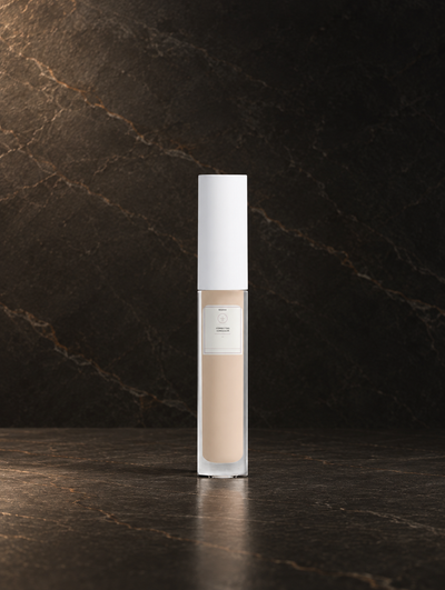 Correcting Concealer — 05 Light Cool, digitally styled bottle on dark stone.